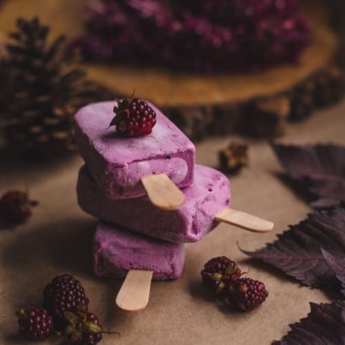 Purple ice-cream bars with berries