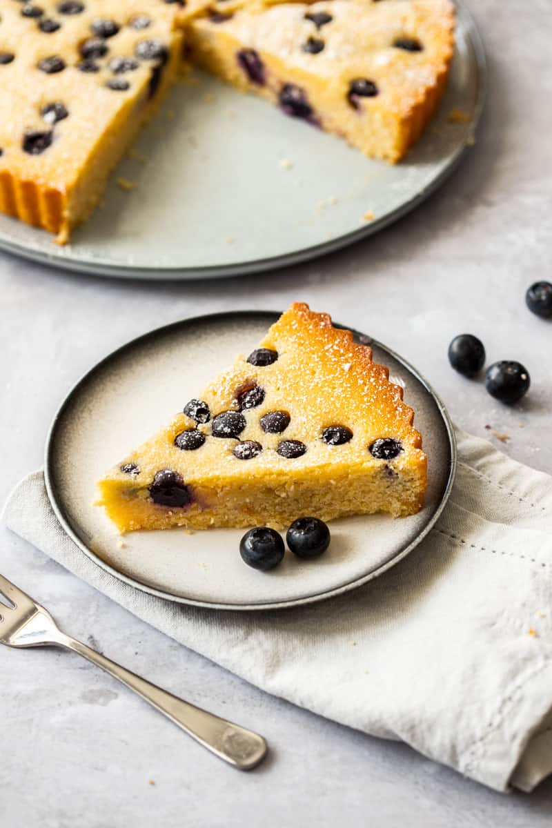 Up close shot of slice of cake on grey plate.