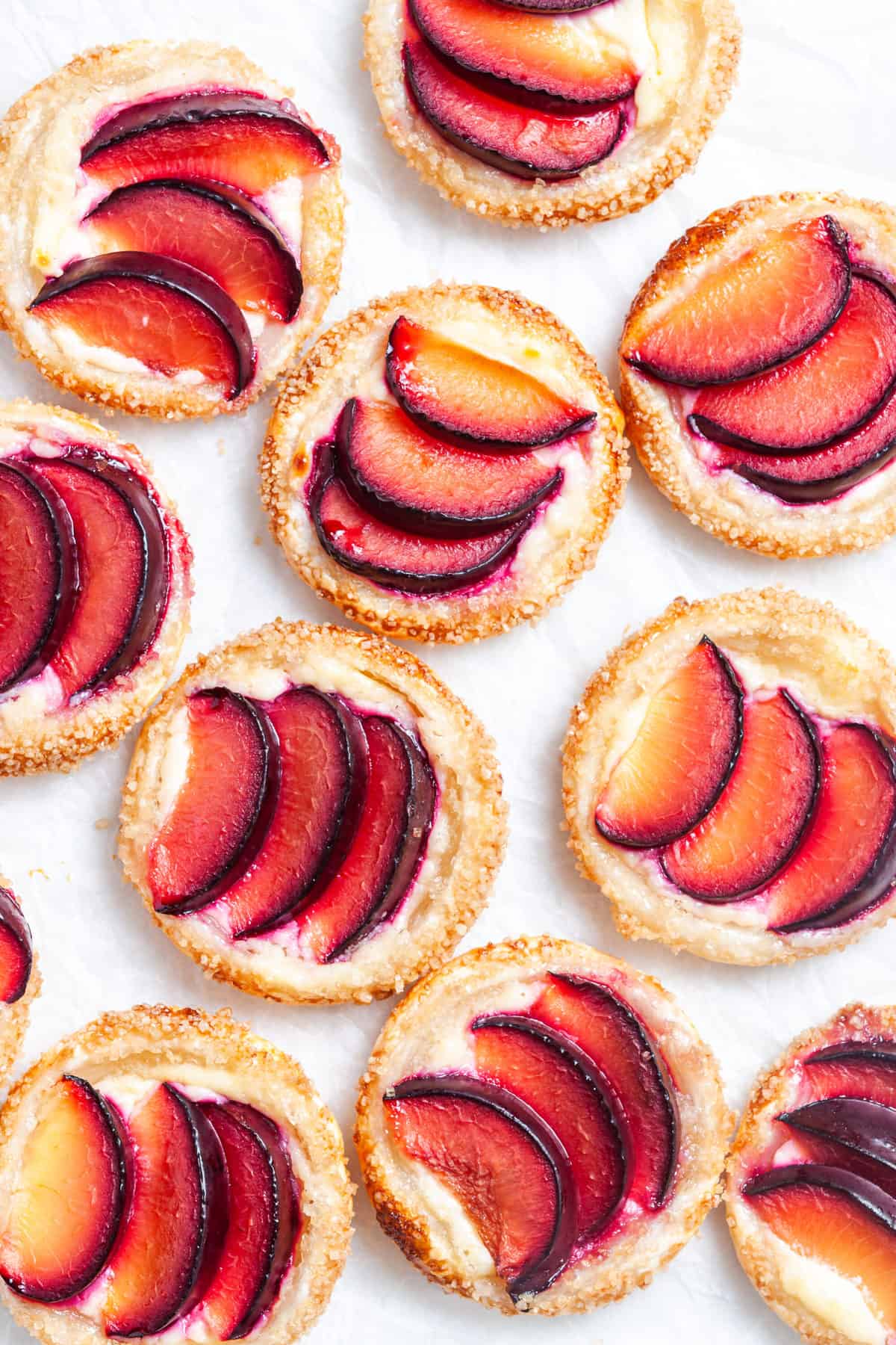 up close shot of tarts on baking paper.