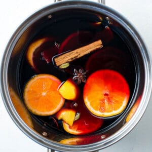 Overhead shot of saucepan with wine ingredients.