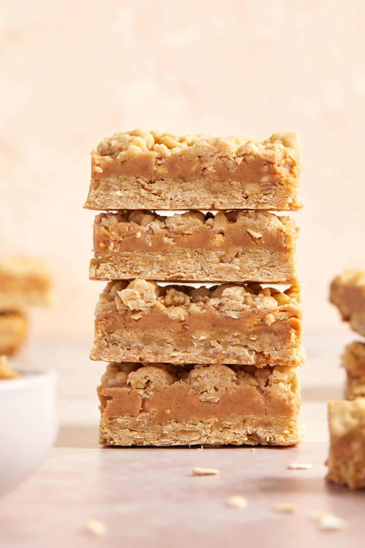 Stack of four cut Peanut Butter Oatmeal Bars.