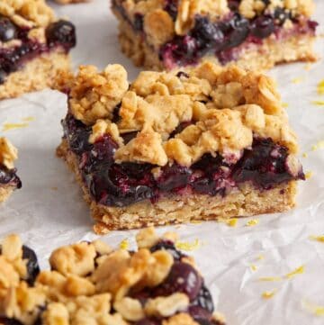 Cut squares of Blueberry Oatmeal Bars on some baking paper.