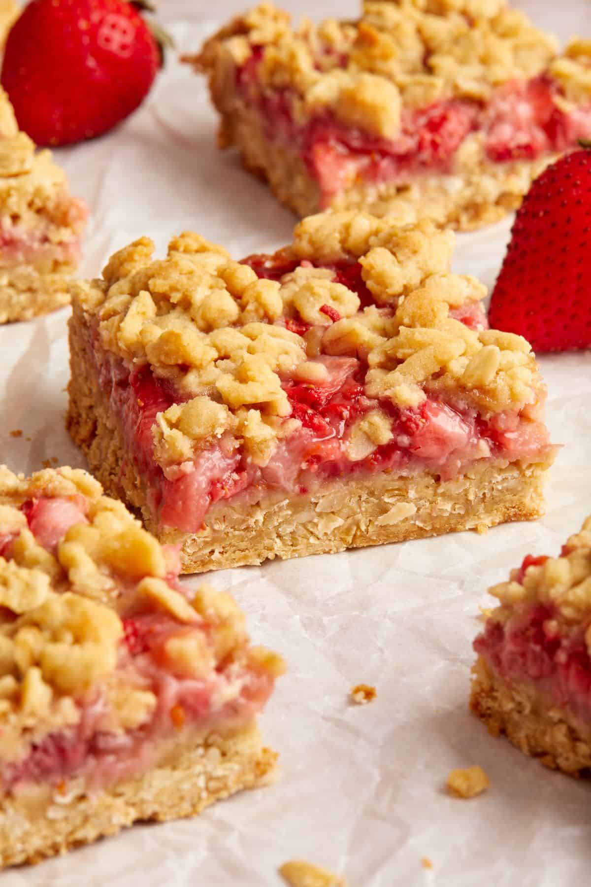 Cut squares of Strawberry Oatmeal Bars on some baking paper.