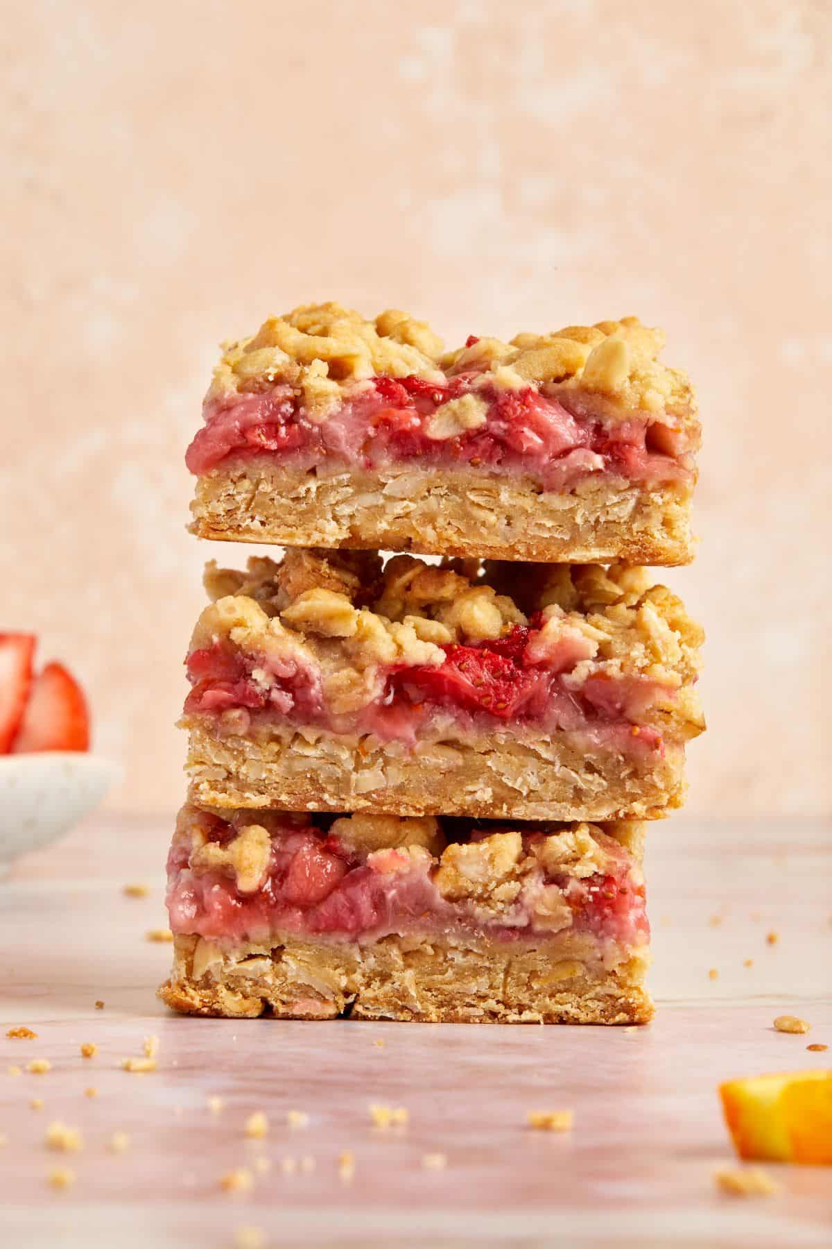 Stack of three pieces of Strawberry Oatmeal Bars.