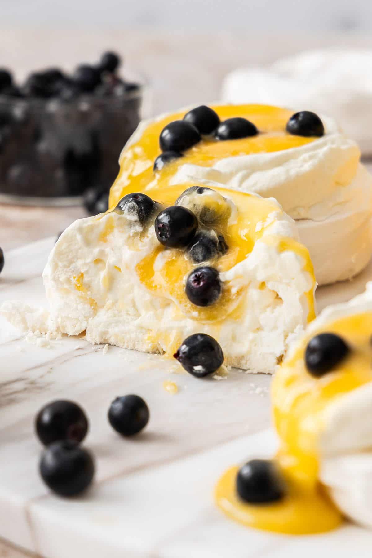 A Lemon Curd Meringue nest cut in half to show the texture.