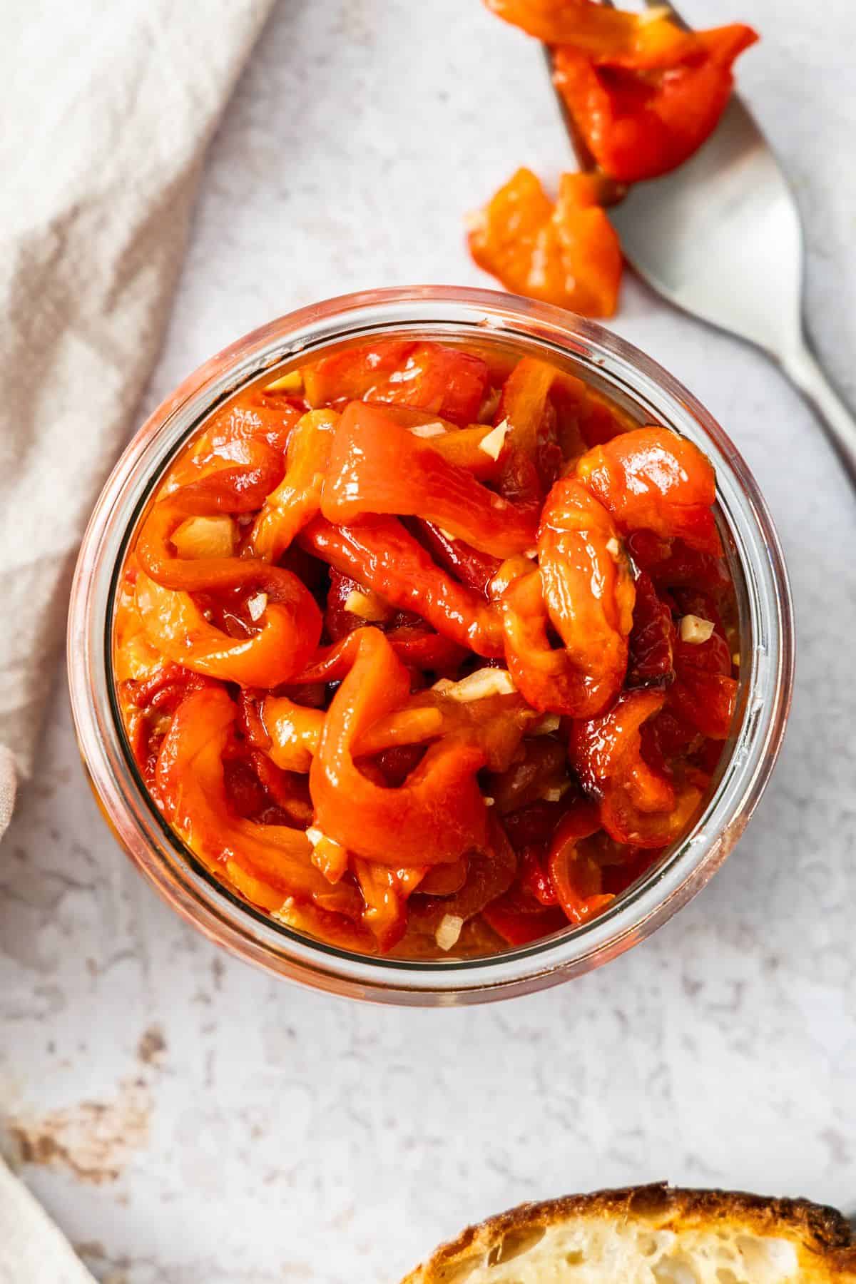 Glass jar full of Roasted Red Peppers.