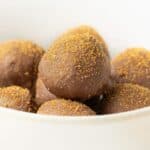 Round white bowl of Champagne Truffles.