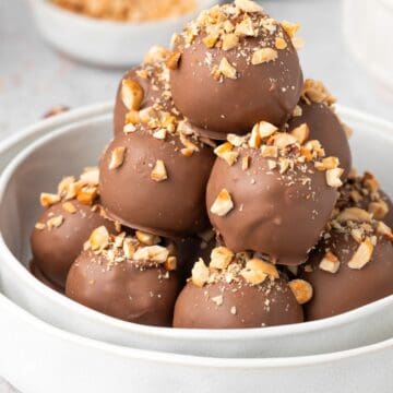 Round dish with stack of Hazelnut Truffles.