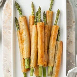 White Platter of Asparagus Filo Rolls.
