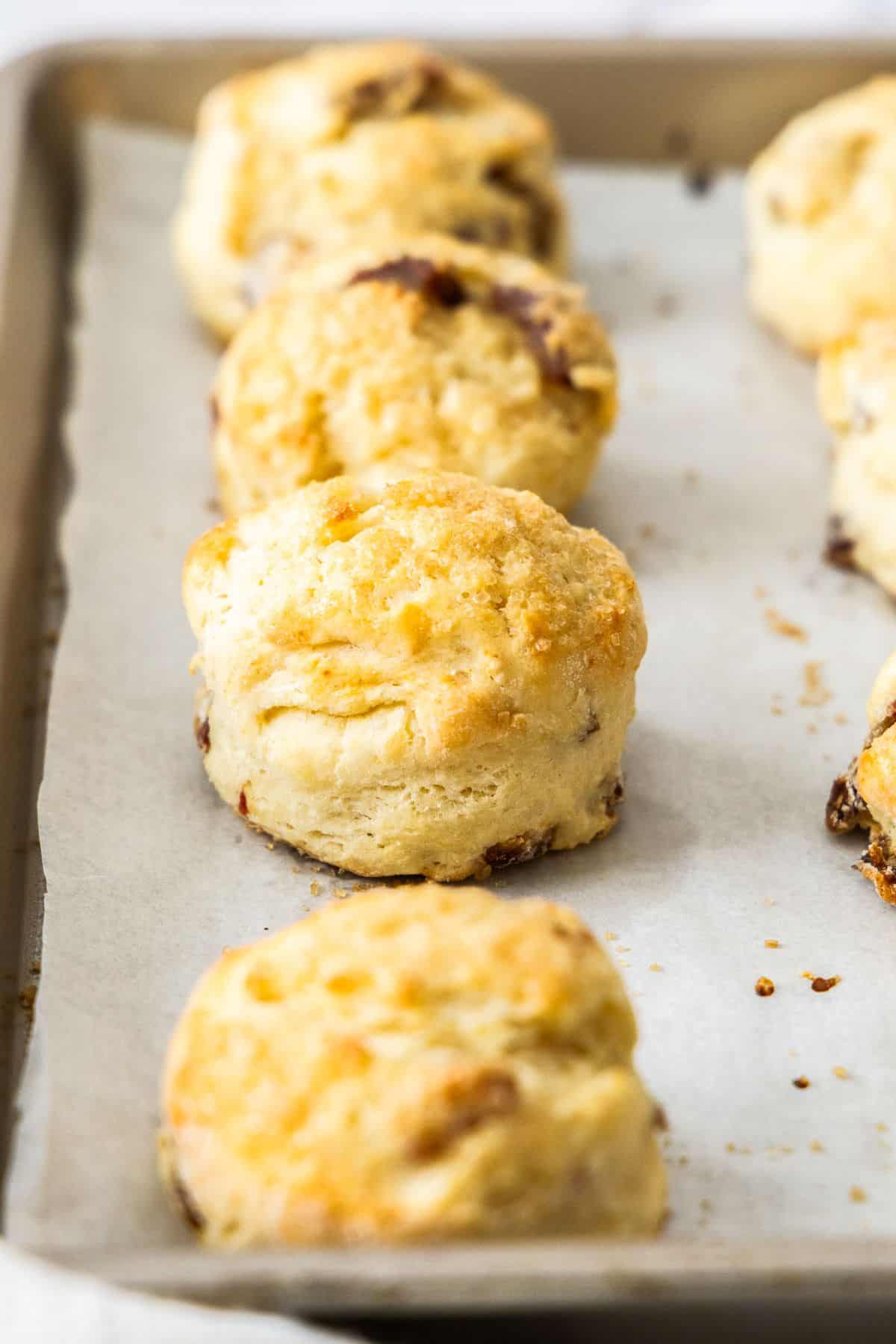 Date and Lemon Buttermilk Scones on a baking paper lined baking tray.