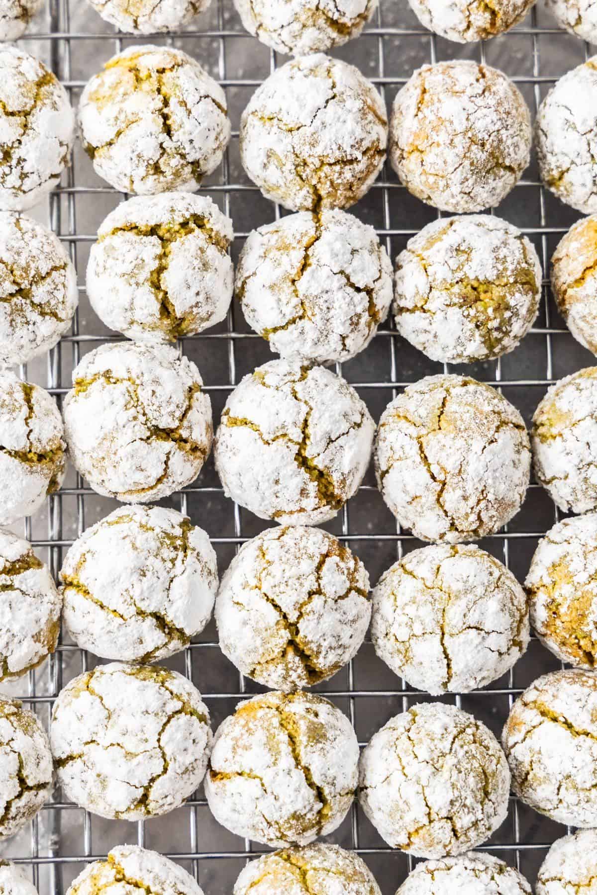 Cooling rack topped with freshly baked Gluten-Free Pistachio Cookies.