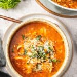 Pinterest image with photo of Mediterranean Chicken Noodle Soup.