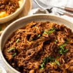 Pinterest image with photo of Mediterranean Pulled Beef.