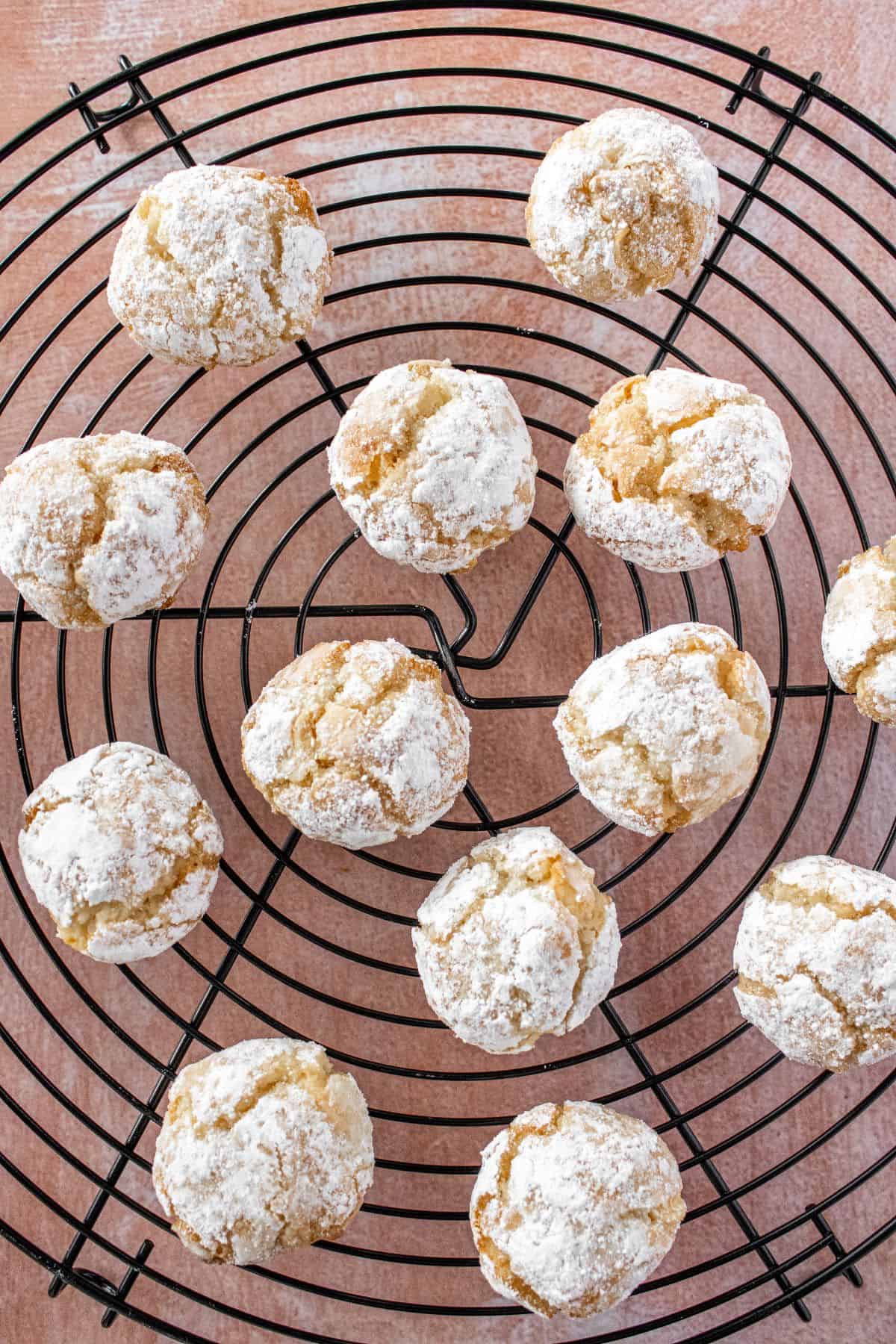 Gluten-Free Macadamia Cookies on a black cooling rack.