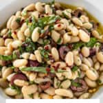 Pinterest image with photo of Marinated White Beans.