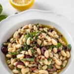 Pinterest image with photo of Marinated White Beans.