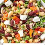 Pinterest image with photo of Mediterranean Bean Salad.