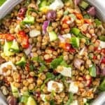 Pinterest image with photo of Mediterranean Lentil Salad.