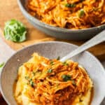 Pinterest image with photo of Mediterranean Pulled Chicken.